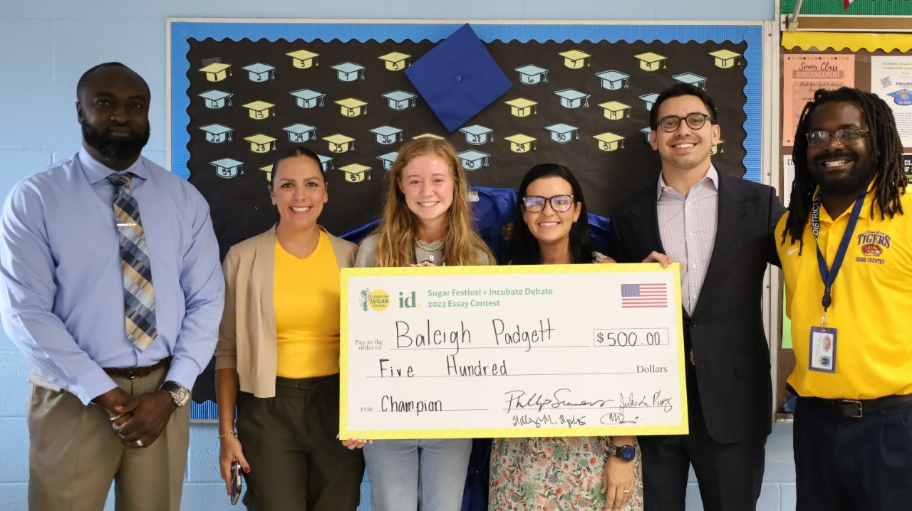 From left to right: CHS Principal Phillip Summers, Clewiston Sugar Festival Director Julia De Plooy, CHS Senior Baleigh Padgett, Clewiston Commissioner Hillary Hyslope, Incubate Debate Founder James Fishback and Jenard Similien (Baleigh's CHS english teacher who reviewed her winning essay).